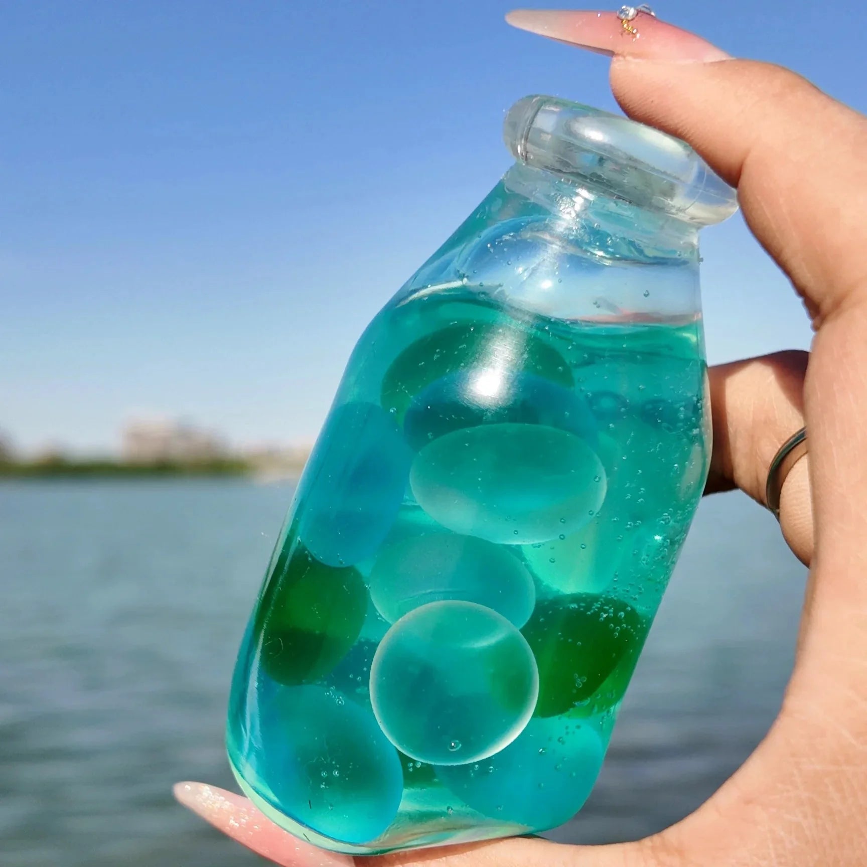 DumplingSquishys clear bottle squishy – Mint Melon Jade Bottle