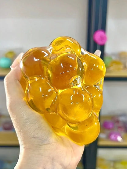 DumplingSquishys Gem Ball Squishy – Jumbo Grape Bead Stress Relief Toy – Yellow Crystal Ball Mega Edition