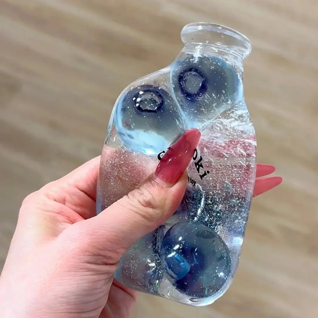 DumplingSquishys Bottle Pop Squishy – Clear Bead Bottle Stress Relief Toy – Glass Blueberry Jar